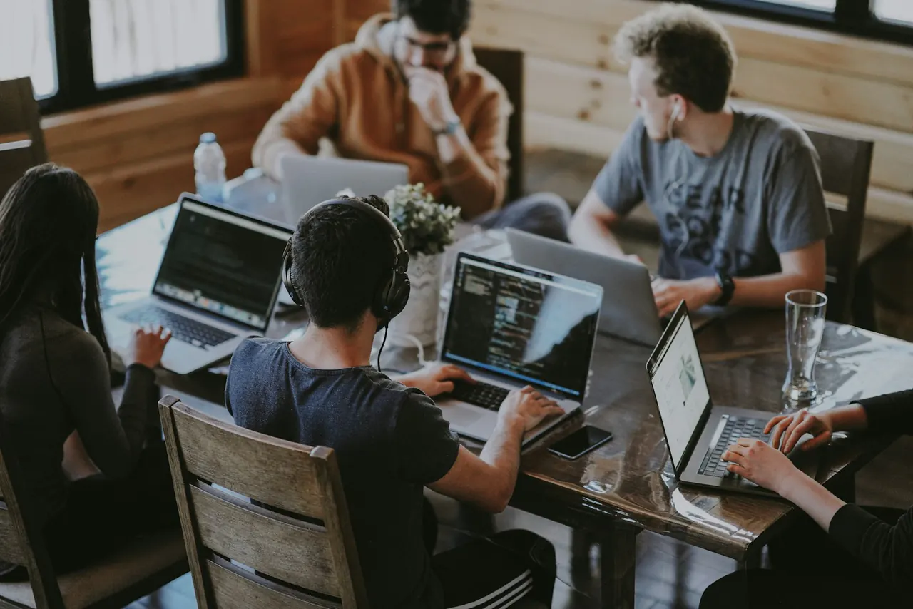 Team collaborating around a table during a working session